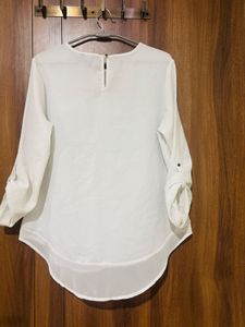 white top with black trousers