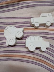 x3 pieces of concrete art cars