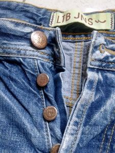 Distressed Blue Denim Jeans