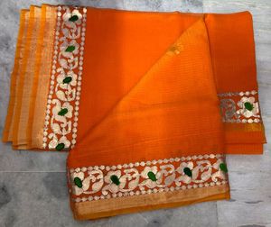 Vibrant Orange Saree with Intricate Border