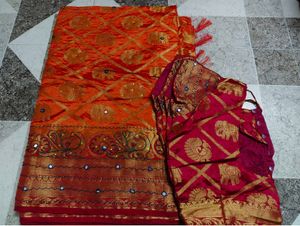 Vibrant Orange Silk Saree with Elephant Motifs