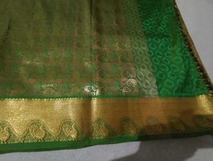 Elegant Green Silk Blouse with Gold Border
