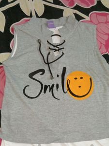 A Very Stylish And Good Looking Medium Sized Smiley 2 In One Top, Can Be A Long Top Also And Crop Also By Shirting In.