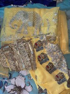 Elegant Yellow Saree with Elephant Motif