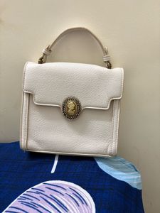 Elegant White Textured Clutch with Vintage Charm