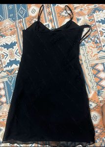 Chic Black Slip Dress with Embellished Neckline