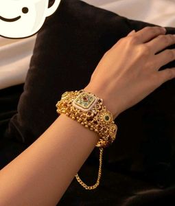 Exquisite Gold Bangle with Kundan Stones
