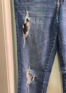 Distressed Blue Denim Jeans