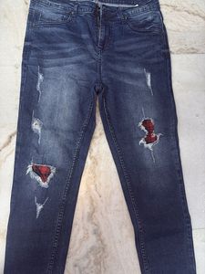 Distressed Denim Jeans with Plaid Detail