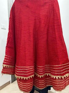 Red lehenga with matching dupatta and golden blous