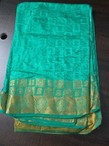 Elegant Teal Saree with Gold Border