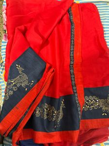 Stunning Red Saree with Peacock Embellishments