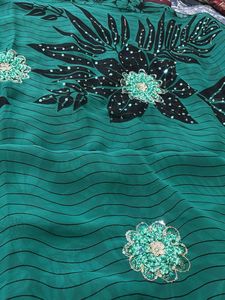 Elegant Green Saree with Black Floral Print