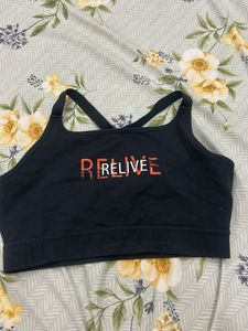 Black Sports Bra with 'RELIVE' Graphic