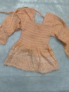 Peach Embroidered Smocked top