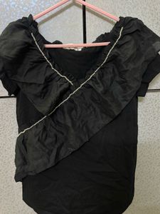 Chic Black Ruffled Top with Pearl Detail
