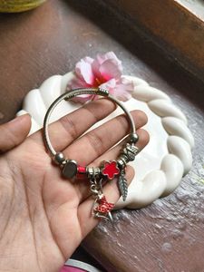 Charming Charm Bracelet with Red Accents