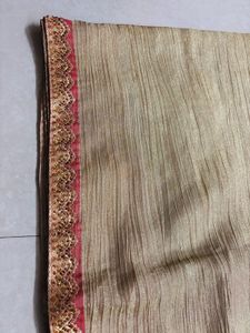 Elegant Gold Saree with Pink Border
