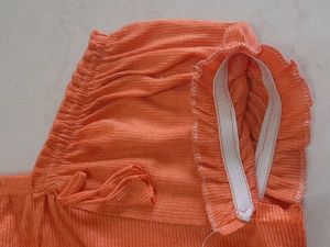 Elegant Orange Gown with Smocked Neckline