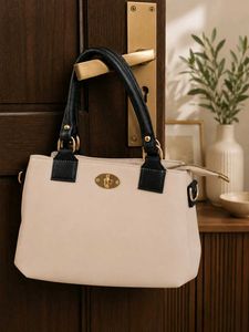 Elegant Beige Handbag with Black Handles