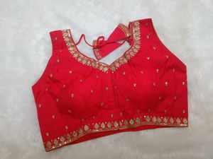 Sleeveless embroidered red blouse