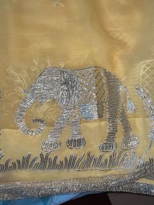 Elegant Yellow Saree with Elephant Motif