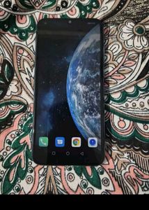 Used Smartphone with Earth Wallpaper
