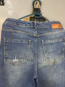Distressed Blue Denim Jeans