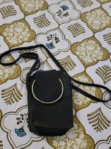 Stylish Black Crossbody Bag with Ring Detail