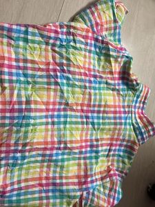 multicoloured shirt with a tie knot