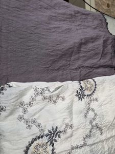 Embroidered fabric with solid matching fabri