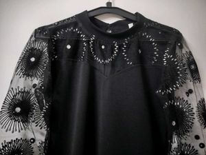 Elegant Black Dress with Sheer Embellished Sleeves