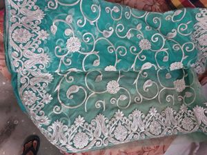 Elegant Embroidered Teal Net Saree