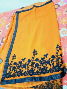 Vibrant Orange Saree with Floral Border