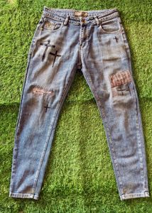 Distressed Blue Jeans with Cross Appliques