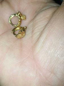 Gold Dangle Earrings with Intricate Design