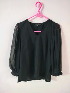 Vero Moda Black Sheer Sleeve Top with nude camisol