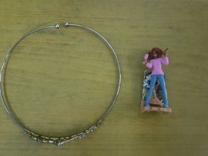 Sparkling crown and artist barbie figurine