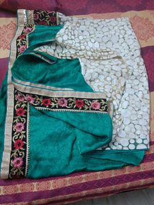 Elegant Teal Saree with Intricate Border