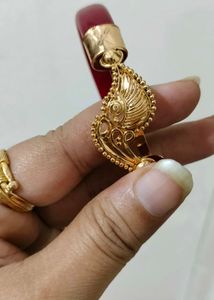 Brand new Gold Bangle with Red Accents