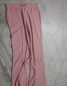 Chic Pink Flared Pants with Gold Chain Detail