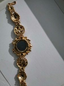 Exquisite Gold Tone Watch with Gemstones