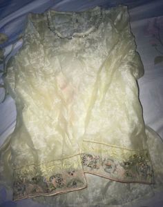 Elegant Yellow Kurta with Embellished Neckline