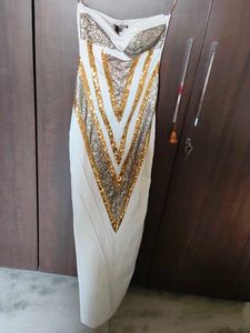 Cleopatra off-shoulder dress.