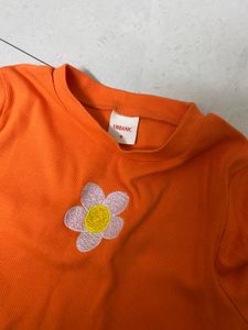 Bright Orange Cropped Top with Flower Detail