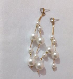 Trendy White Pearls Long Drop Earrings.