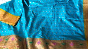 Stunning Teal Saree with Gold Accents