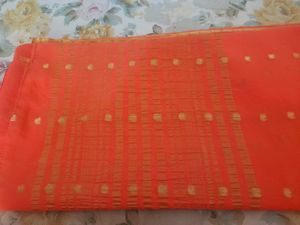Vibrant Orange Saree with Golden