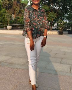 A green color floral print peplum top