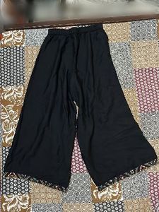 Elegant Black Palazzos with Embroidered Hem